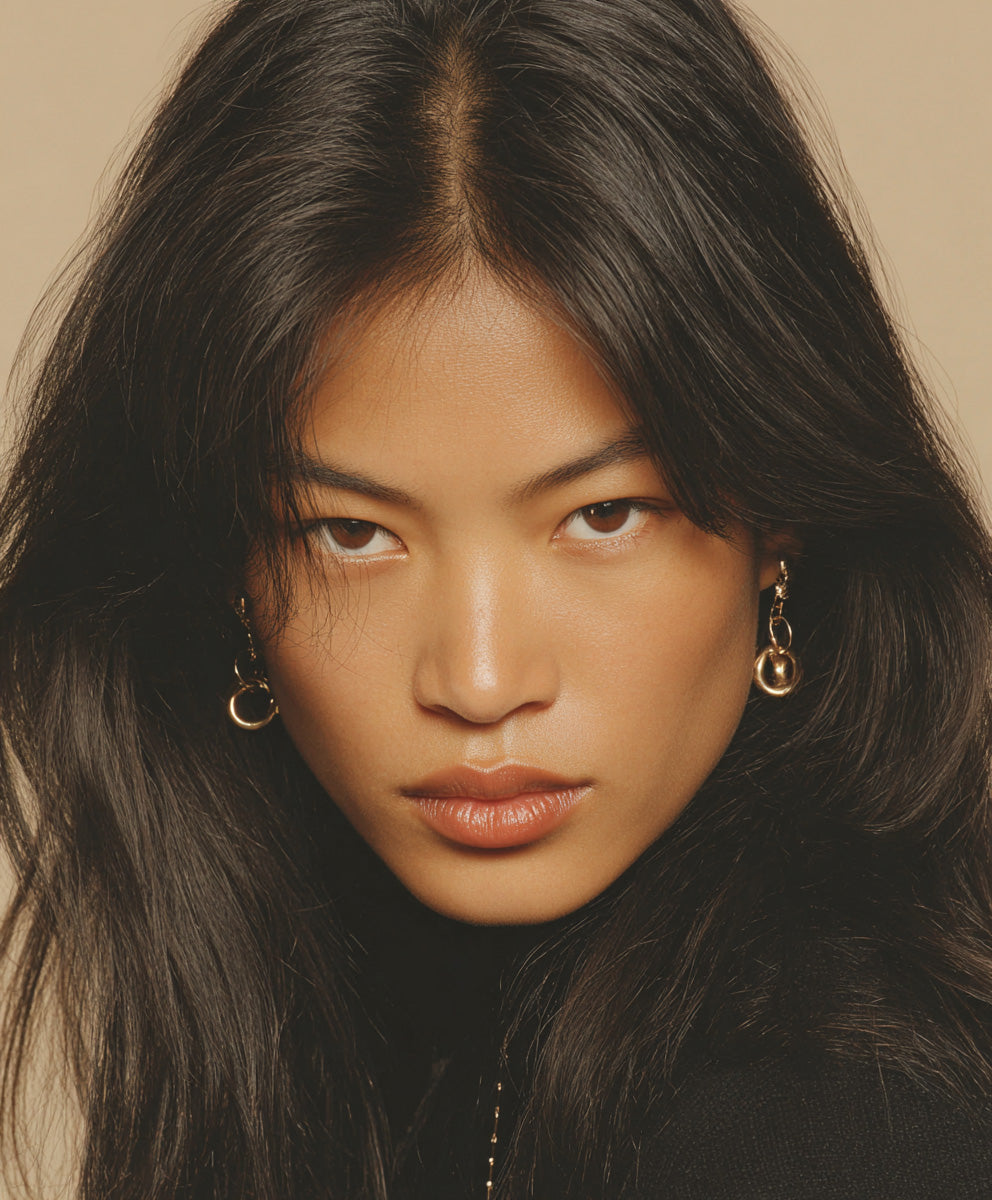 fashion-portrait-woman-with-black-hair-and-gold-earrings-editorial-aesthetic-makestories.com